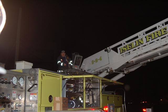 Ex-Chief Christensen mans the turntable during the live burn drill on November 2, 2009.